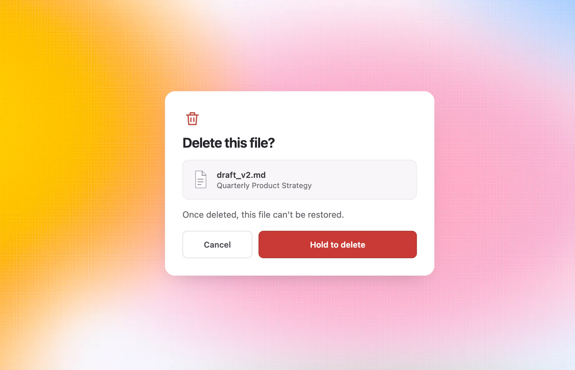 Hold-to-delete confirmation interaction for permanently deleting a file
